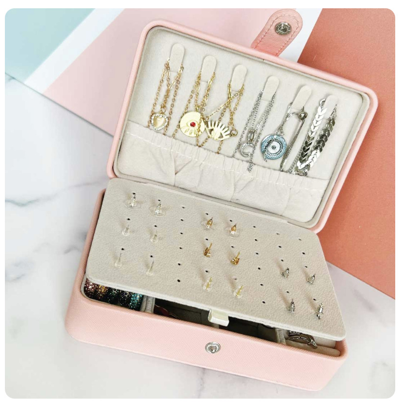 Jewelry organizer box with earrings and necklaces, travel jewelry case