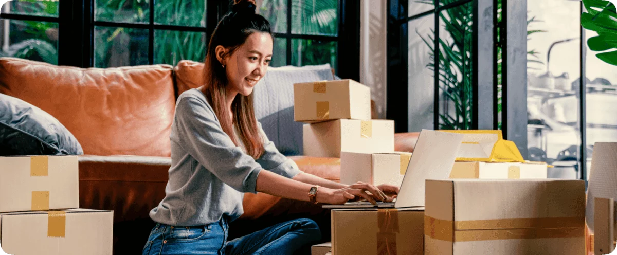 Seller using Zendrop dropshipping software on laptop